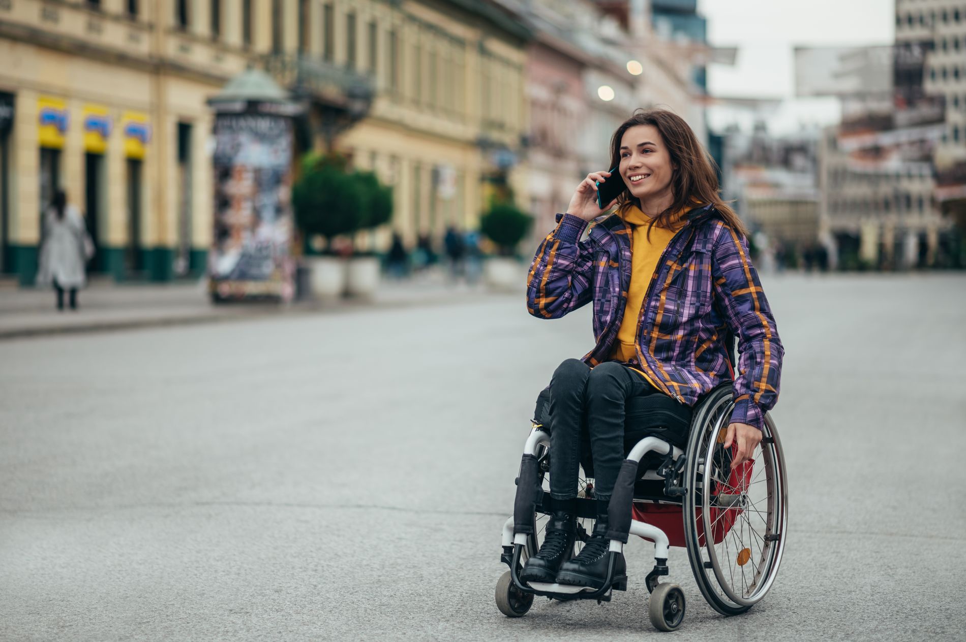 woman with disability using a smartphone while out 2022 04 01 13 54 52 utc